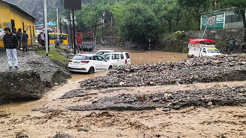  Vehicles stuck in the mud after a rain-triggered landslide, in Ramban district of J&K, Sunday, April 20, 2025. 