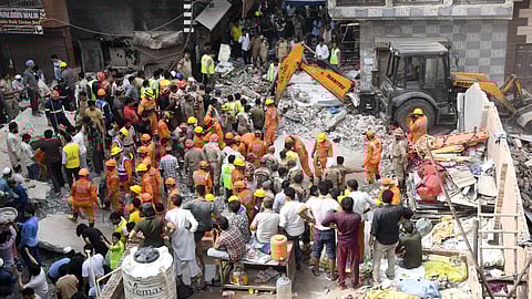 Rescue operation underway after a building collapsed at Shakti Vihar area, in New Delhi on Saturday. Four persons died and several others are feared trapped after the four-storey building collapsed in the early hours of Saturday. 