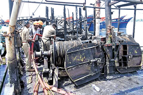 The boat that was partially gutted in fire at Kalamukku harbour in Vypeen 
