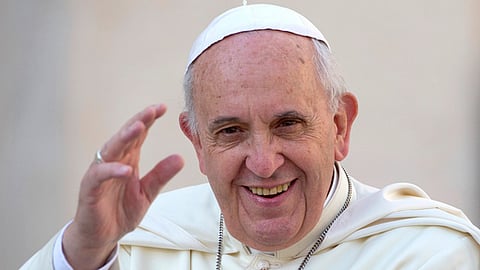In this image from Sept. 17, 2014, Pope Francis delivers his blessing as he arrives to hold his weekly general audience, in St. Peter's Square, at the Vatican.