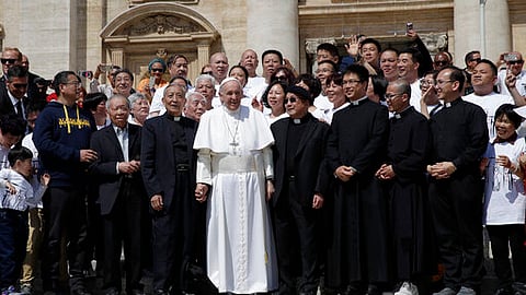 Pope Francis poses a group of faithful and bishops from Shanghai during his weekly general audience in St. Peter's square at the Vatican Wednesday, May 22, 2019.