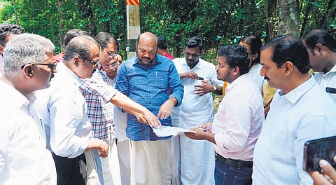 Industries Minister P Rajeeve addresses the concerns raised by landowners during his visit to the proposed site of the Global City at Ayyampuzha on Monday