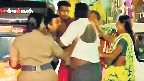 The couple being attacked by their family members on Monday.