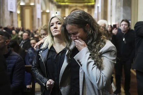 A worshipper cries during Mass at the Cathedral in Buenos Aires, Argentina, following the Vatican’s announcement of Pope Francis’ death, Monday, April 21, 2025. 