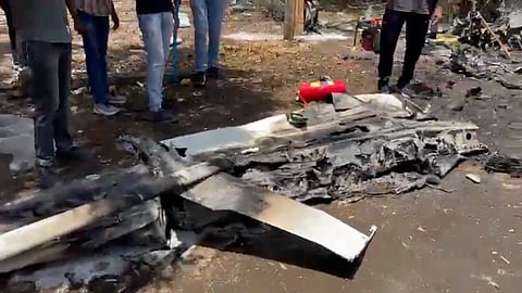 Crash-landed aircraft at a residential area near Giria Road in Amreli.