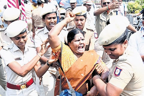 Police detain a TARATDAC member who stage protest in Chennai