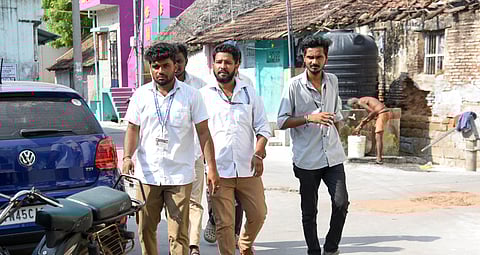  City corporation health workers roaming at drinking water contaminated Minnappan street in Woraiyur, Tiruchy on Monday.