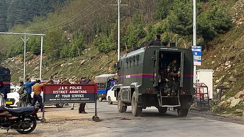 Security personnel rush to the spot after terrorists attacked a group of tourists at Pahalgam, in Anantnag district, Jammu & Kashmir, Tuesday, April 22, 2025. 