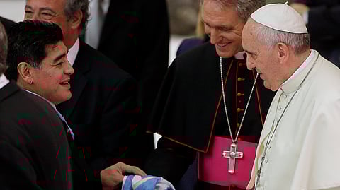 Argentine football legend Diego Maradona, left, greets Pope Francis in the Paul VI hall at the Vatican, Sept. 1, 2014 (Photo | AP)