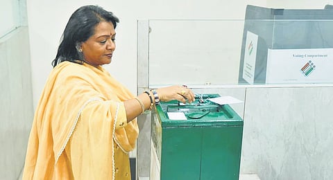Mayor Gadwal Vijayalaxmi casts her vote at the GHMC office in Hyderabad on Wednesday