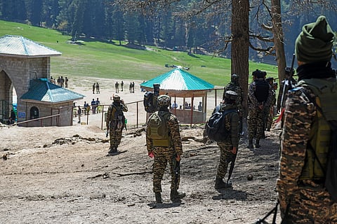 Security personnel carry out a search operation at the Baisaran area in Pahalgam following a terrorist attack the previous day, Wednesday, April 23, 2025.