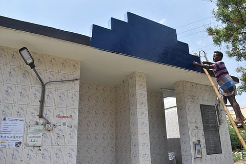 After a huge uproar and a petition was filed by a Congress councillor against naming public toilets after great leaders Kakkan and Anna Durai, the CCMC officials swung into action and painted the facility on Tuesday.