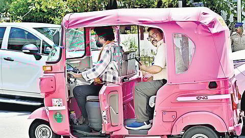 A man driving a pink auto with a passenger at the secretariat in Chennai on Thursday 