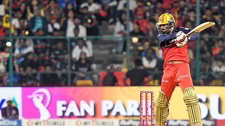 Jitesh Sharma playing a shot in an IPL 2025 match.