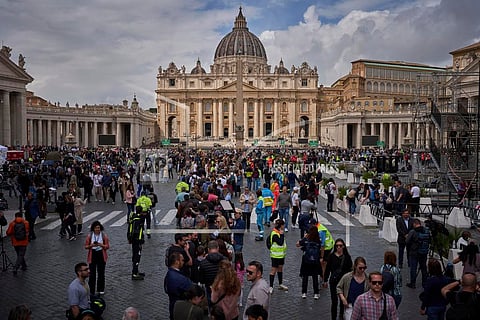 People line up to enter St. Peter's Basilica to pay their respects to Pope Francis lying in state, at the Vatican, Thursday, April 24, 2025.