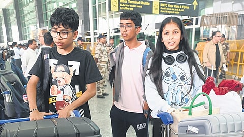 Children, who were on holiday in Kashmir, arrive at Kempegowda International Airport in Bengaluru on Wednesday