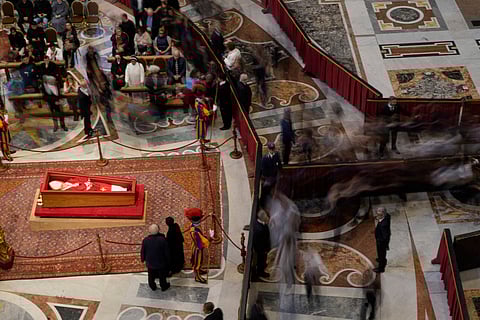 People pay their respects to the late Pope Francis, who will lie in state inside St. Peter's Basilica until Friday, at the Vatican, Thursday April 24, 2025.