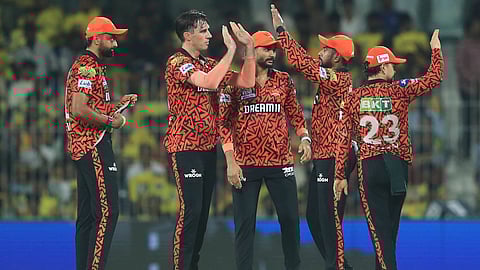 Sunrisers Hyderabad's captain Pat Cummins, left, celebrates with teammates after the dismissal of Chennai Super Kings' Ayush Mhatre (Photo | AP)