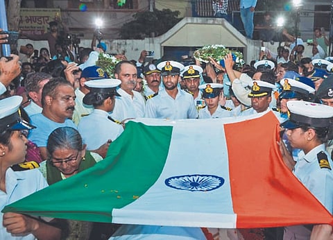 Navy personnel pay tribute to the mortal remains of Lt Vinay Narwal, who was killed in the Pahalgam terror attack, at Delhi Airport on Wednesday
