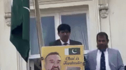 The Pakistani official can be seen taunting them from the balcony of the mission building at Lowndes Square.