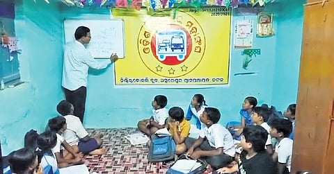 Narayan Prasad Singh teaching students in his coaching centre at Asureswar.