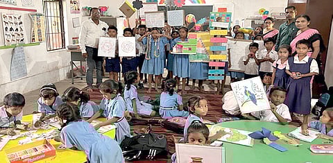 Students with learning materials in the classroom of a government school at Jharsuguda