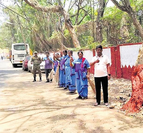 BBMP associated with B.PAC volunteers clean the stretch from Domlur flyover to Ejipura on Saturday