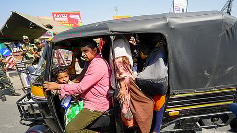 Pakistani nationals arrive at the Integrated Check Post at the Attari-Wagah border to move to their country, near Amritsar, on Saturday, April 26, 2025.