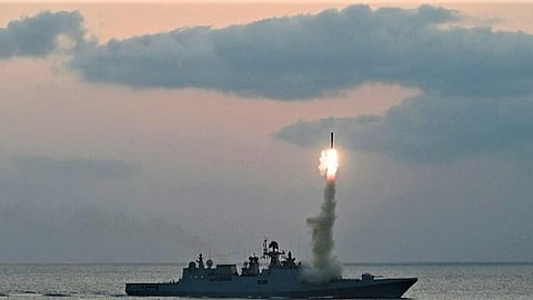 Visuals of BrahMos anti-ship and anti-surface cruise missiles being launched from a fleet of warships.