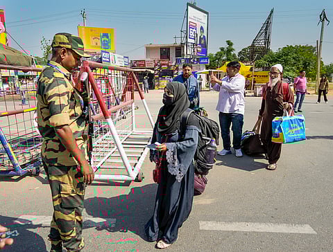 Pakistani nationals arrive at the Integrated Check Post at the Attari-Wagah border to move to their country, near Amritsar, Friday, April 25, 2025. India has announced the closure of the Attari border for all movement as part of heightened security measures following the Pahalgam terror attacks.
