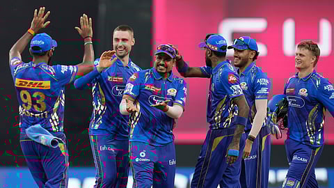 Mumbai Indians' Will Jacks, second from left, celebrates the dismissal of Lucknow Super Giants' captain Rishabh Pant with his team mates during the Indian Premier League cricket match between Mumbai Indians and Lucknow Super Giants at Wankhede Stadium in Mumbai, India, Sunday, April 27, 2025.