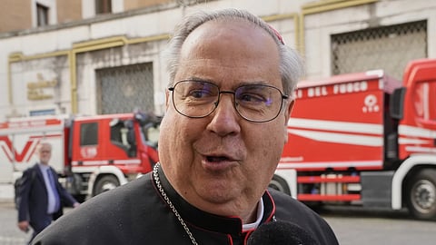 Argentine Cardinal Angel Sixto Rossi speaks to reporters as he arrives for a college of cardinals' meeting, at the Vatican, Monday, April 28, 2025