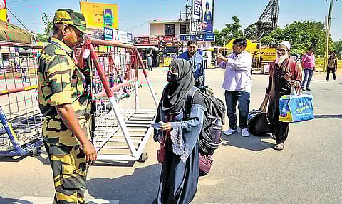 Pakistani nationals arrive at the Integrated Check Post at the Attari-Wagah border. 