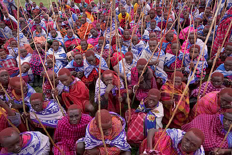 Children of the Maasai tribe gather around during the Enkipaata ceremony, a Maasai male rite of passage, specifically the initiation of boys, marking the transition from childhood to becoming a moran (warrior) in Olaimutiai, Narok County, Kenya Thursday, April 24, 2024. 
