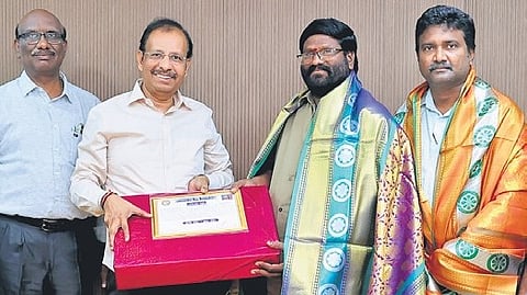 TGSRTC officials felicitate Venkateshwarlu on Monday.