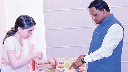 SME secy Shalini Pandit briefing CM Mohan Majhi on the materials in the kit