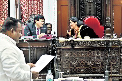 Mayor R Priya interacting with Commissioner J Kumaragurubaran as a councillor raises a query during the council meeting on Wednesday.