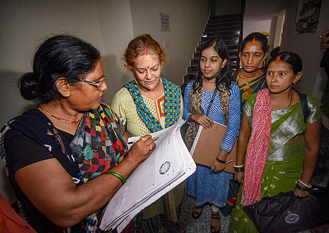In this file photo from Wednesday, Aug. 2, 2023, an enumerator collects information from residents during Bihar's caste-based survey. On April 30, 2025, the Cabinet Committee on Political Affairs approved the inclusion of caste enumeration in the upcoming national census.