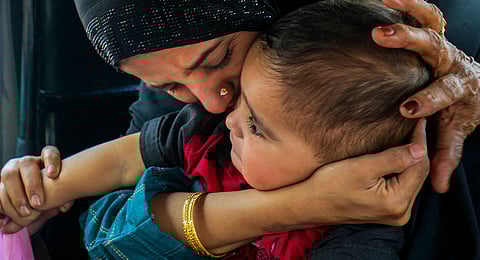 A Pakistani national woman gets emotional while leaving for Pakistan after her son, with Indian citizenship, was stopped by authorities to go with her, at the Attari-Wagah border checkpost near Amritsar, Tuesday, April 29, 2025.