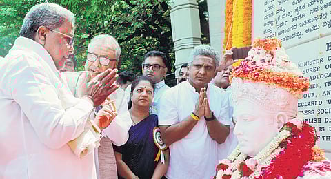 Chief Minister Siddaramaiah pays tributes to Basavanna on Basava Jayanti in Bengaluru on Wednesday .