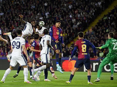 Inter Milan's Dutch defender #02 Denzel Dumfries (2L) scores his team's third goal during the UEFA Champions League semi final first leg football match between FC Barcelona and Inter Milan at the Estadi Olimpic Lluis Companys in Barcelona on April 30, 2025. 