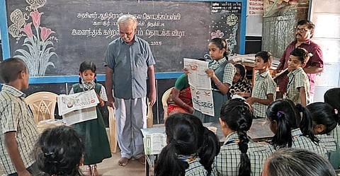 Students, teachers, and parents engage in a newspaper reading session during the workshop at Adi Dravidar Welfare School, Papakurichi in Tiruchy 