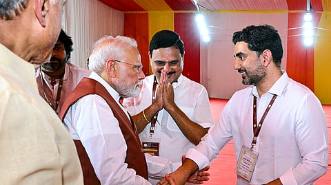 Prime Minister Narendra Modi being welcomed at a public meeting by Andhra Pradesh Chief Minister N Chandrababu Naidu and Minister Nara Lokesh.