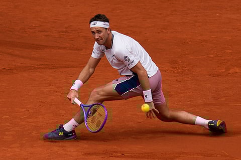Casper Ruud of Norway returns the ball against Francisco Cerundolo from Argentina during men's semifinal at the Madrid Open tennis tournament in Madrid, Spain, Friday, May 2, 2025. 