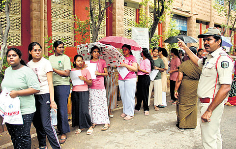 Candidates line up at AU Engineering College in Vizag on Sunday.