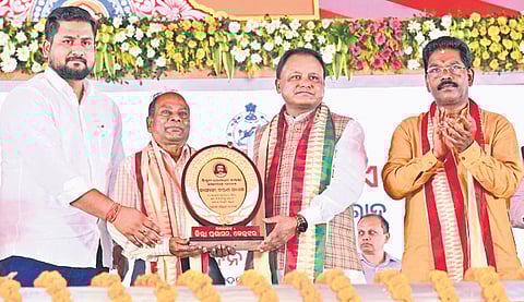 CM Majhi felicitating Kangali Charan Naik with Dharanidhar award 