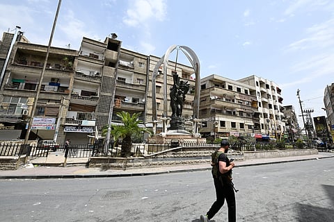 Migrants push a small boat in an attempt to reach Britain.