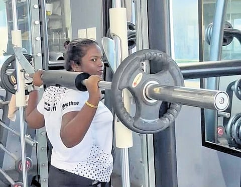Rajalaskhmi at the gym showing the techniques to clients