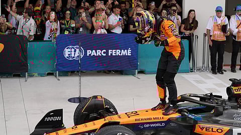 McLaren driver Oscar Piastri of Australia stands on top of his car after winning the Formula One Miami Grand Prix auto race Sunday, May 4, 2025, in Miami Gardens. 