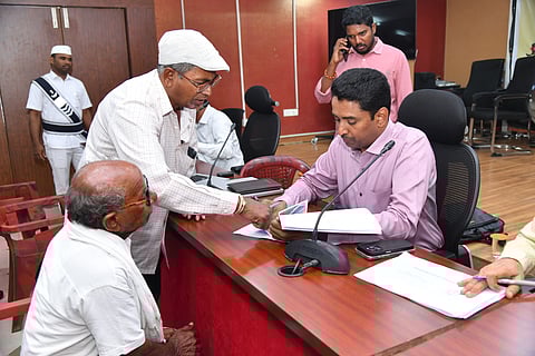 NTR district collector G Lakshmisha takes representations from the public during PGRS. 